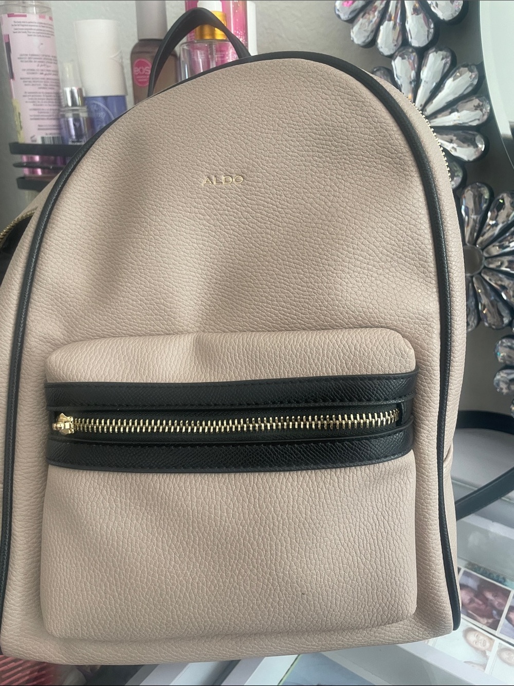 Aldo Pebbled Beige Mini Backpack with Black Trim and Gold Hardware